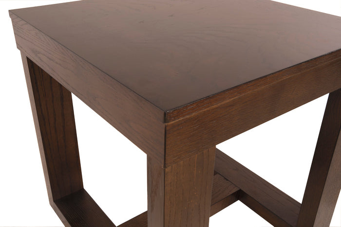 Corner view of dark wood end table with open lower shelf and thick legs.
