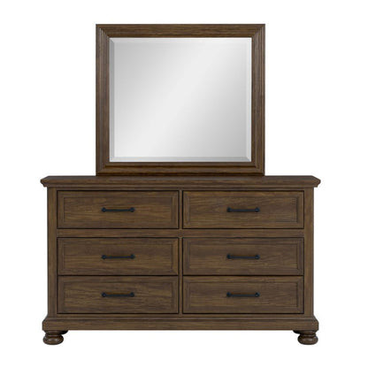 Bedroom mirror with cherry wood frame on dresser with six drawers and black pulls