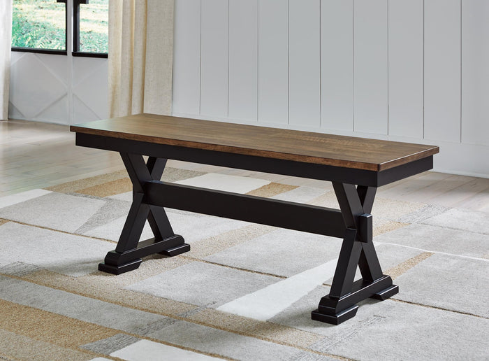 Dark wood dining bench with plank seat and pedestal base