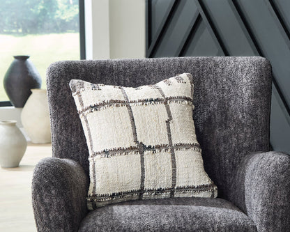 Plaid throw pillow with dark grid stitching on textured off-white cover