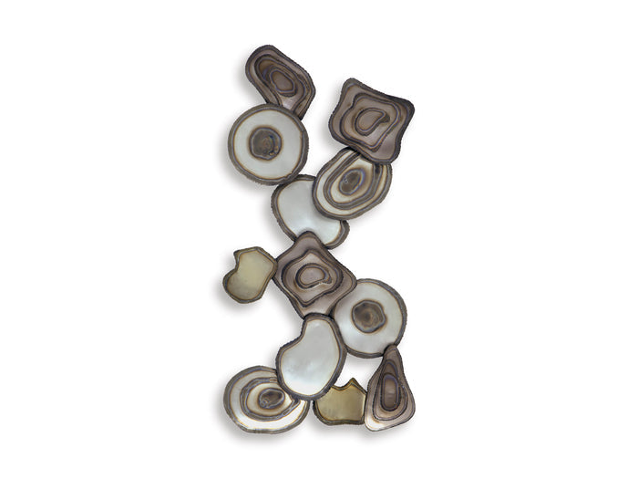 Abstract wall decor featuring layered ovals and circles arranged in a vertical cluster