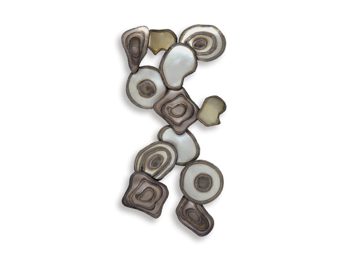 Small abstract wall decor arrangement of layered oval and circular metal accents