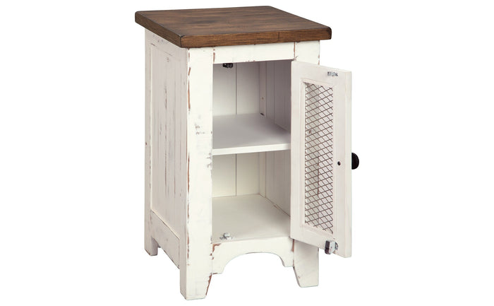 Chairside end table with dark brown top, white distressed cabinet, open door with mesh panel