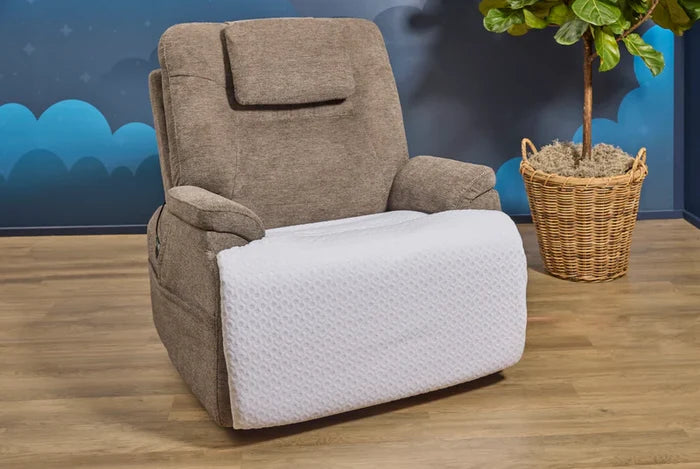 Recliner chair protector with white textured cover on seat and footrest