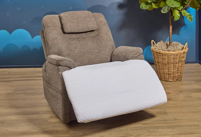 Recliner chair protector with white textured cover covering seat and recliner footrest